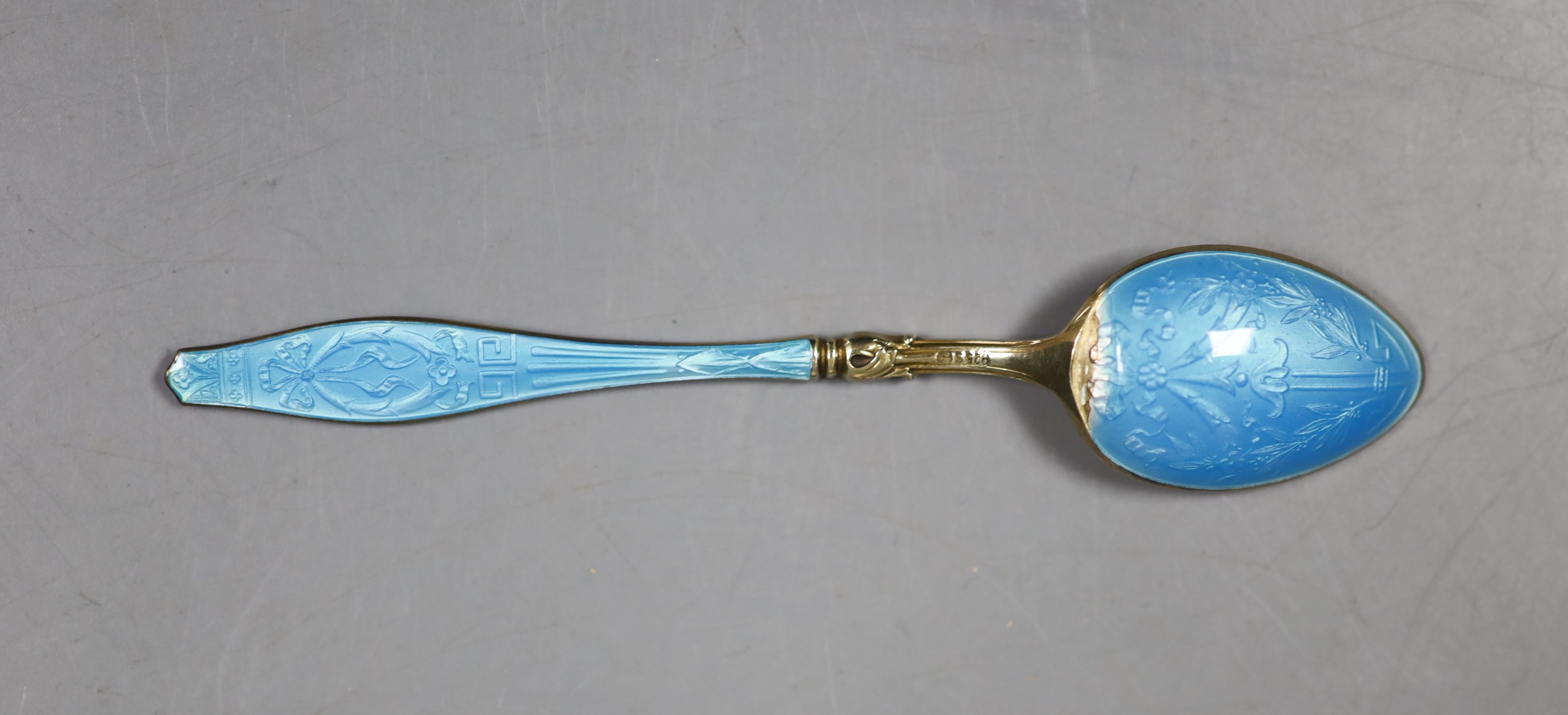 A cased set of six Norwegian gilt white metal and enamel coffee spoons (enamel a.f.).